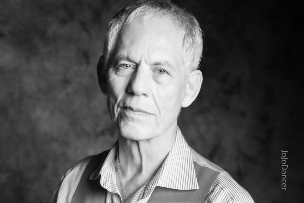 Black-and-white close portrait of Rudi Harst