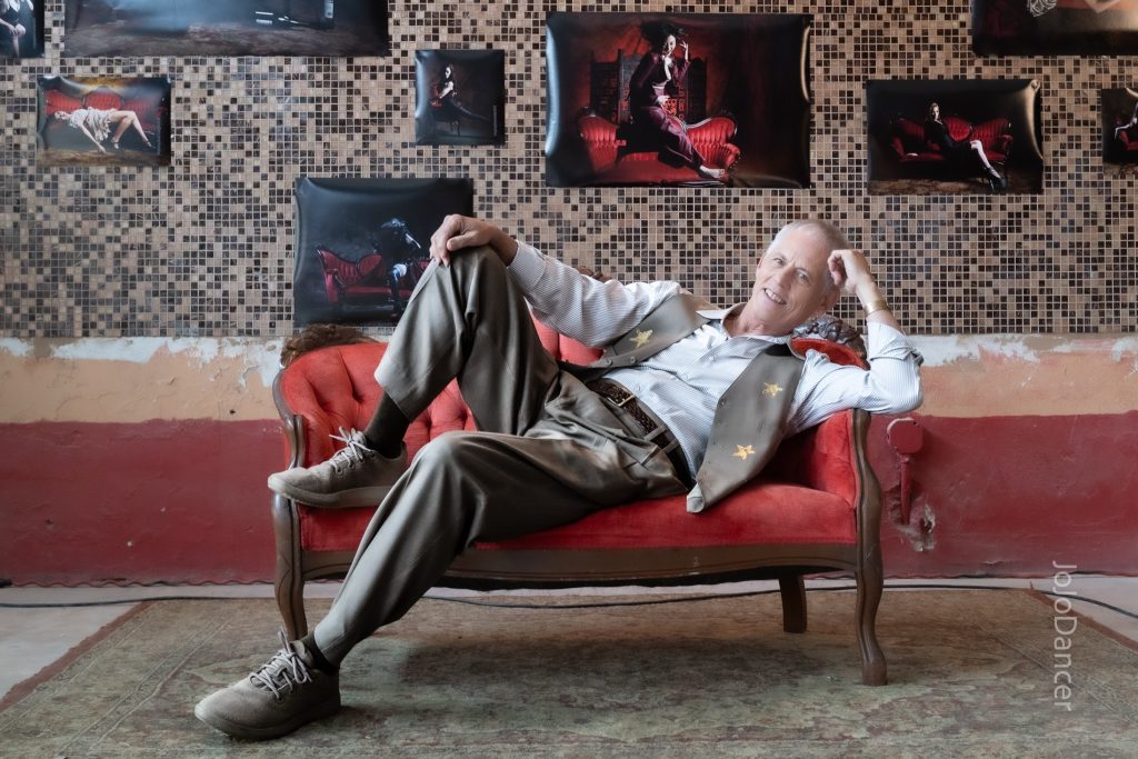 Rudi Harst reclining in a candid studio portrait