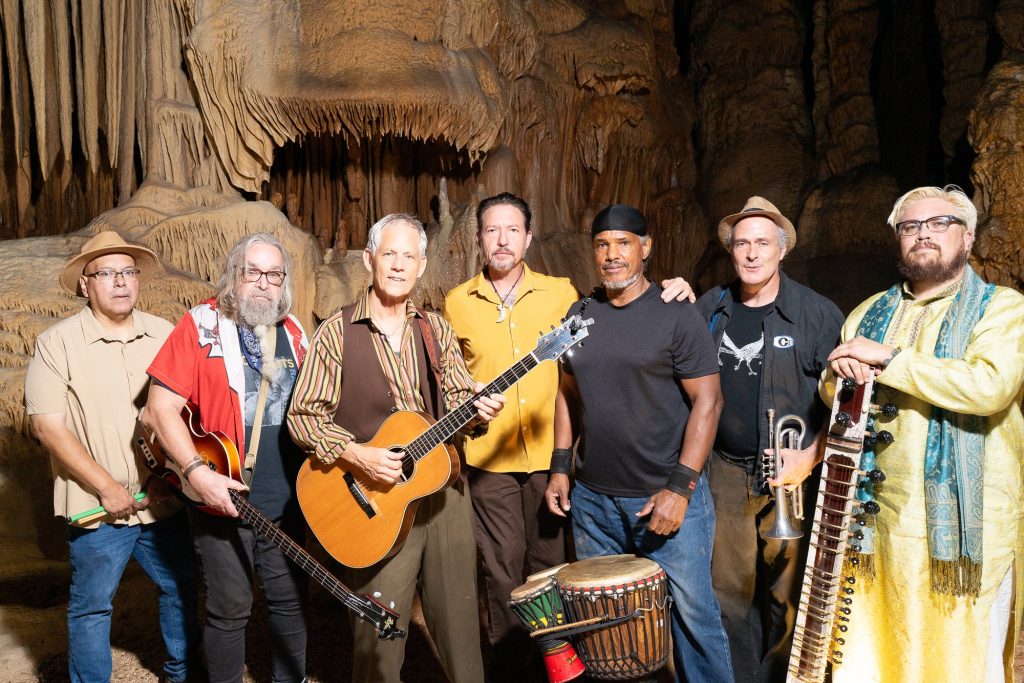 Rudi Harst and six fellow musicians posing with their instruments